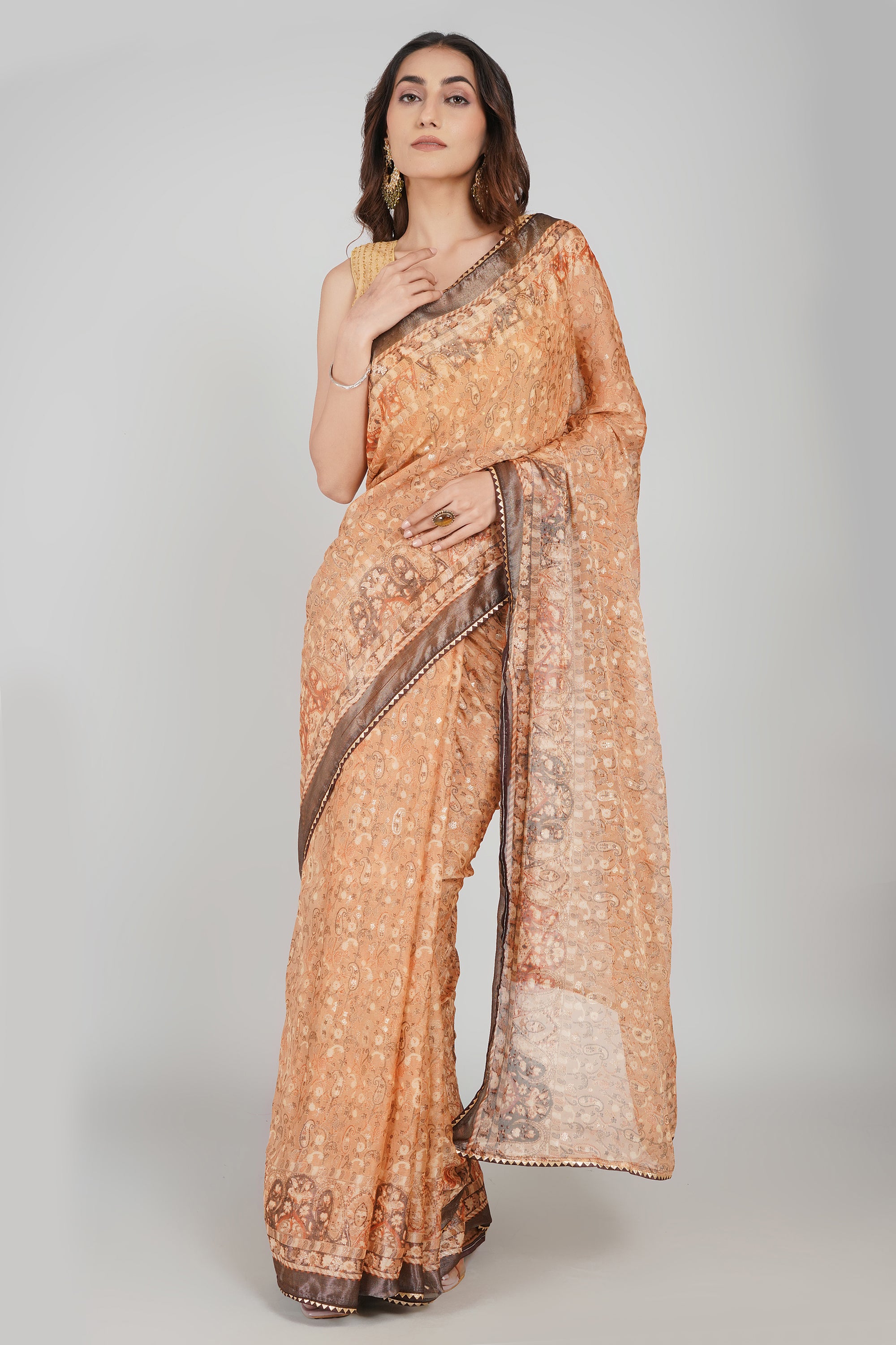 Peach Orange Brasso Printed Saree with Metallic Grey Border