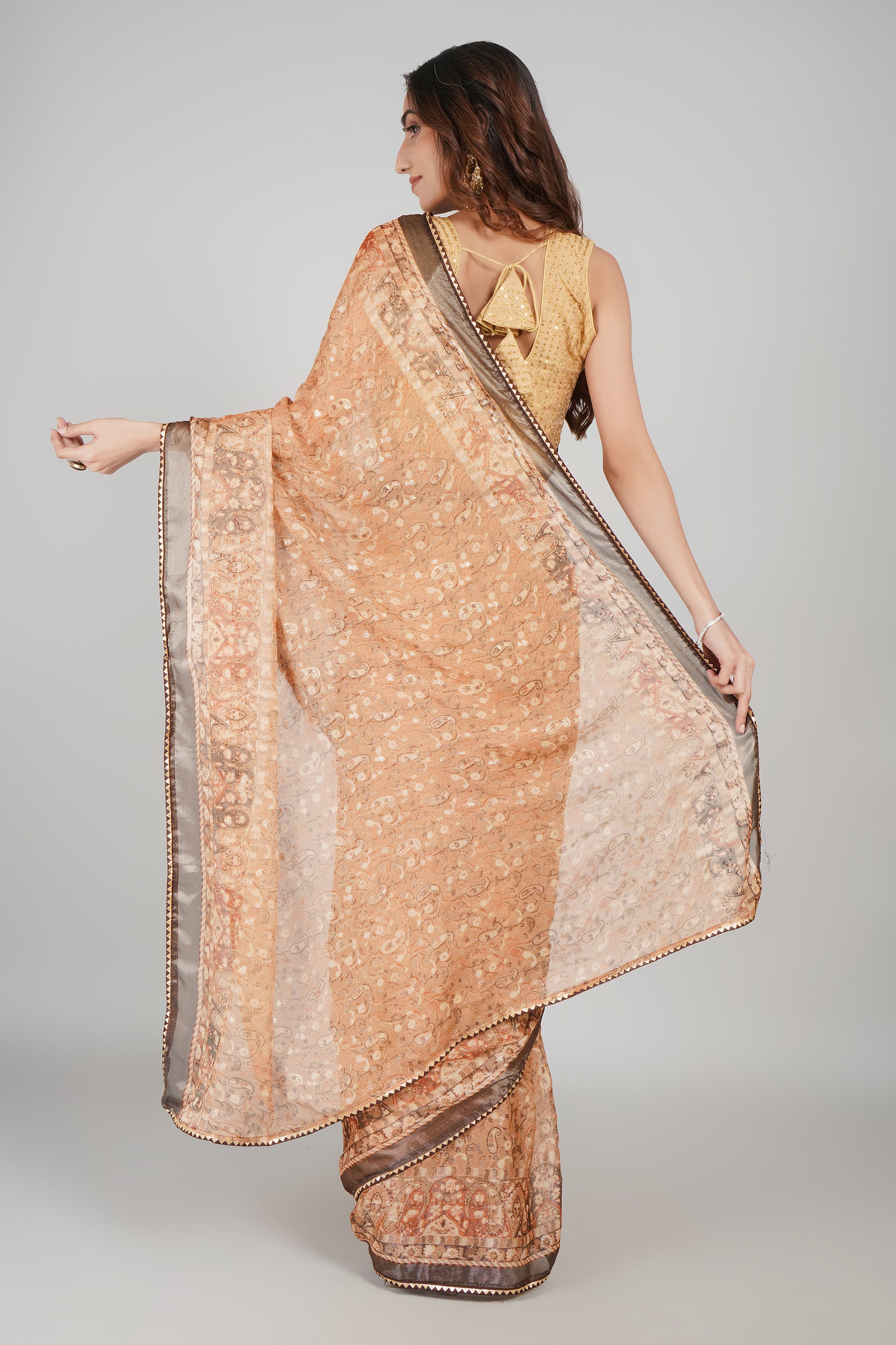 Peach Orange Brasso Printed Saree with Metallic Grey Border
